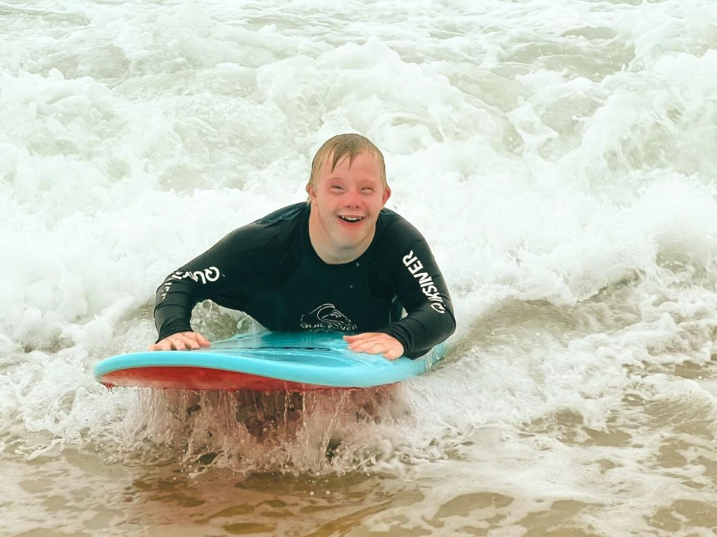 Child surfing action background